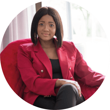 Isilumko-Activate A woman in a red blazer sitting in a chair.